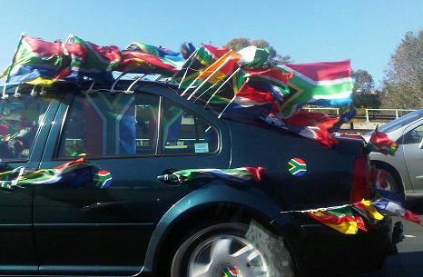 Car decorated with flags